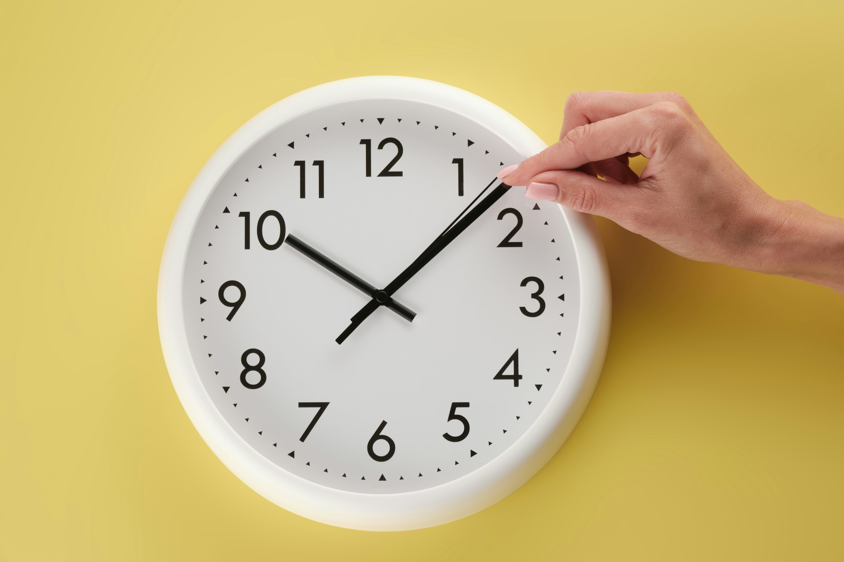 Person touching a clock