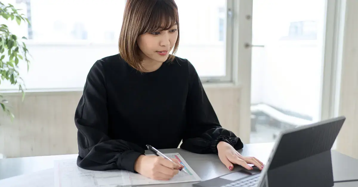 Woman preparing documents to respond to an IRS bank levy.