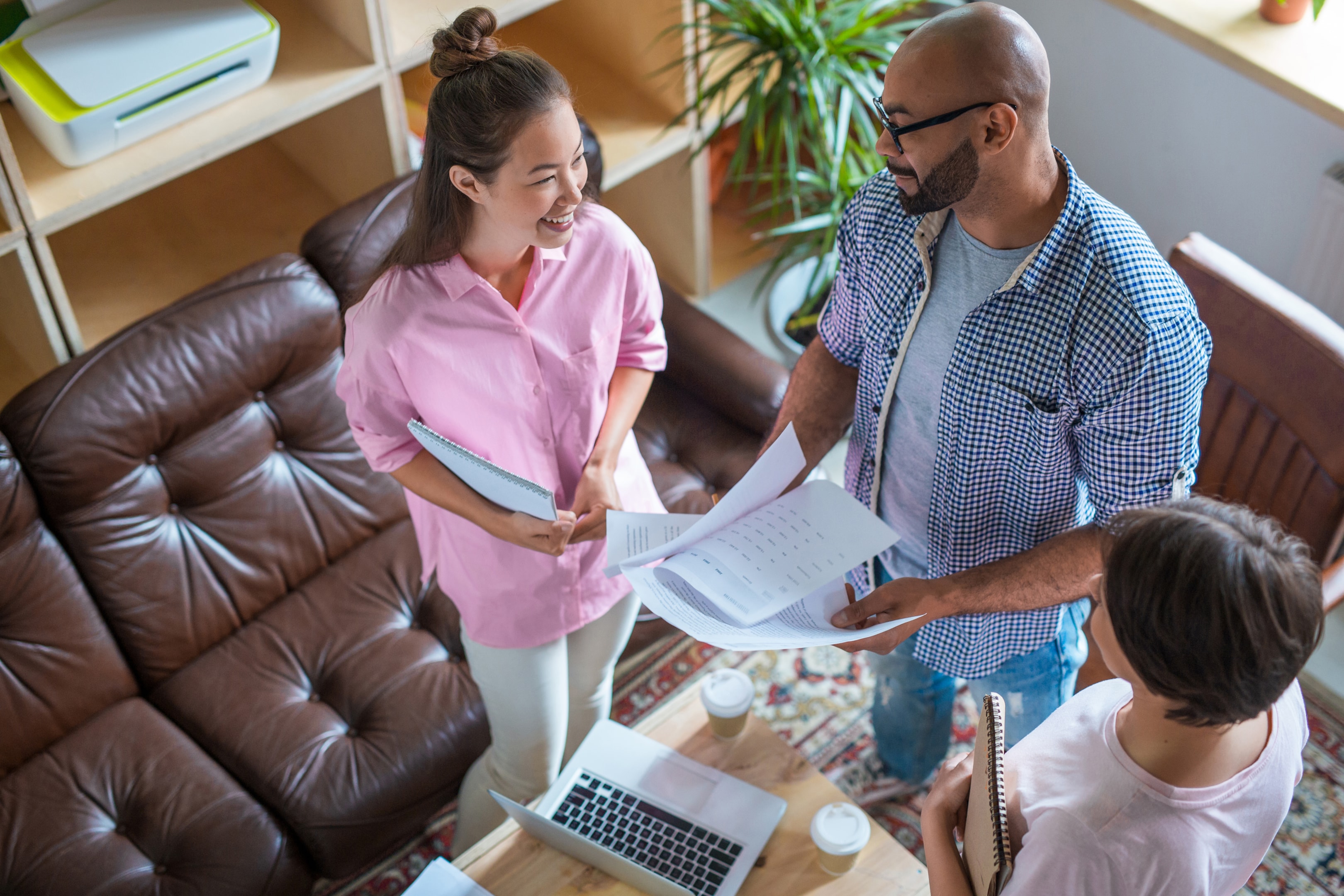 Group of business people standing analyzing data graphs commercial law business owners