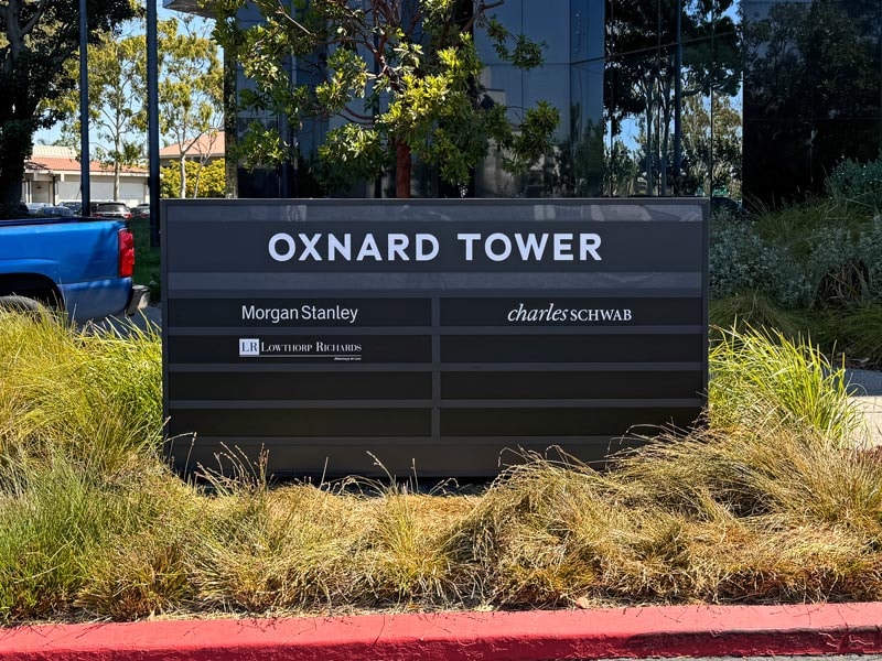 This modern monument sign for Oxnard Tower features a clean design with changeable panels—easily updated for new tenants, like we did for Lowthorp Richards LLP.