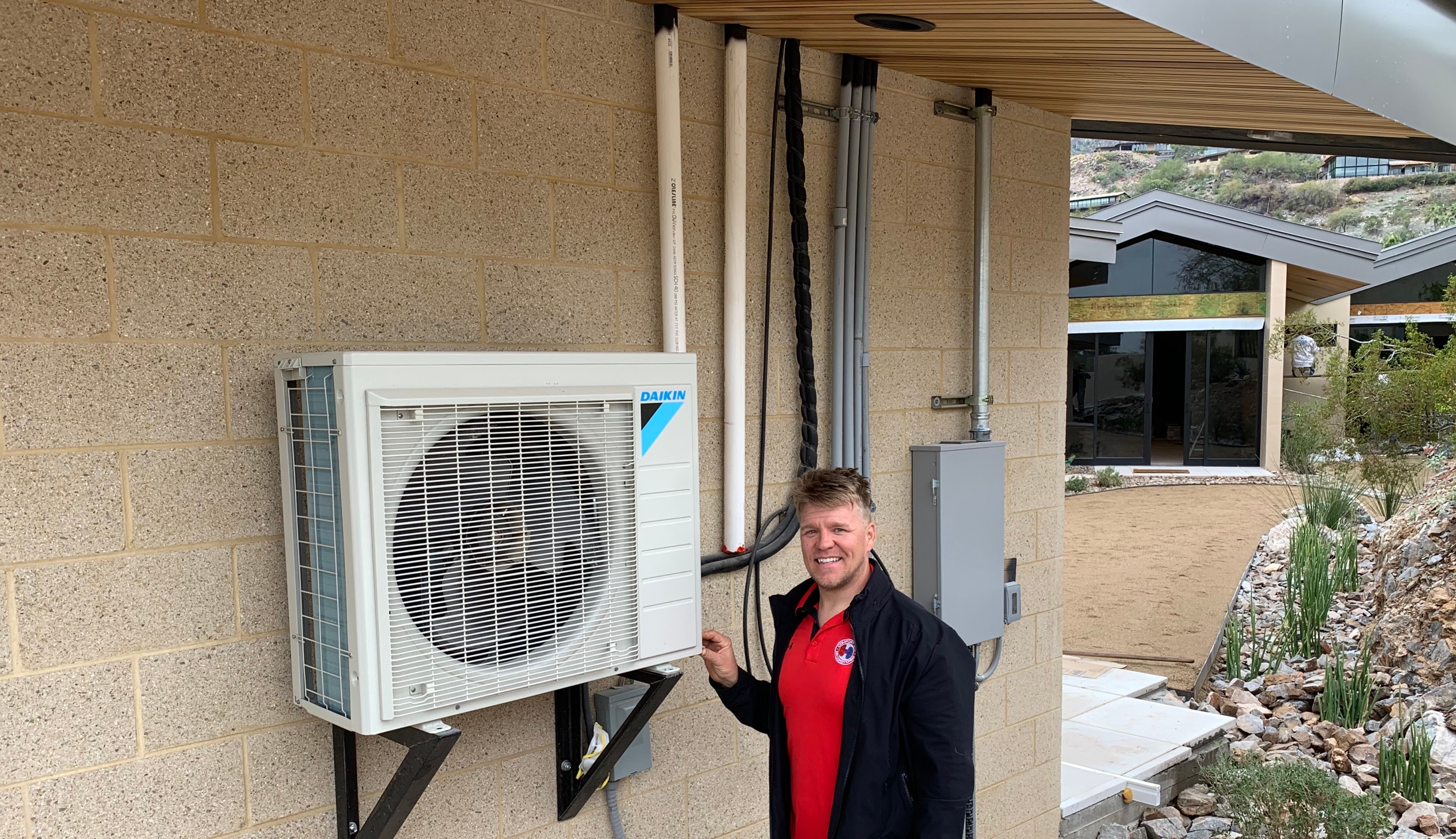 One of our technicians installing a new airconditioning in Arizona