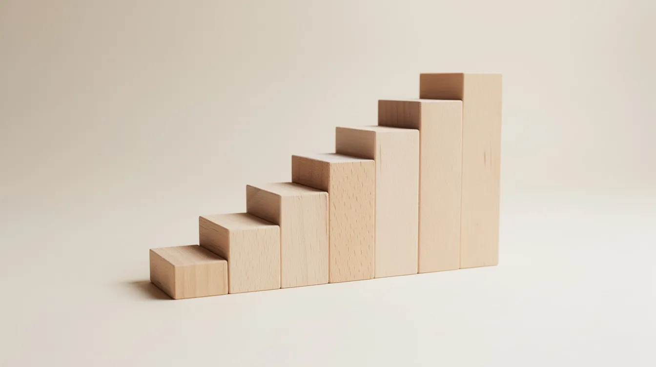 The image depicts a rising staircase made of wooden blocks against a light background, symbolizing gradual growth. This visual metaphor reflects the journey of sales teams as they engage potential customers through outbound sales strategies and tools, emphasizing the importance of consistent progress in the sales process.