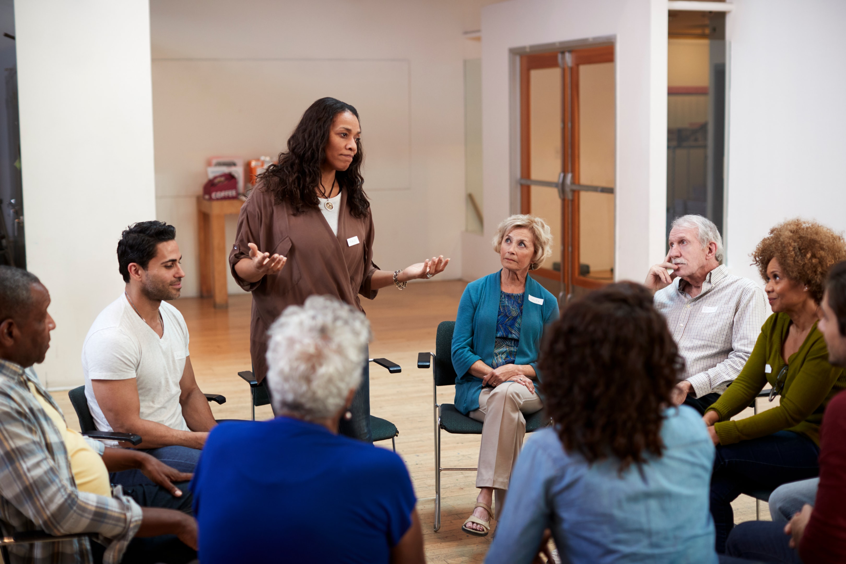 Woman speaking in a support group setting
