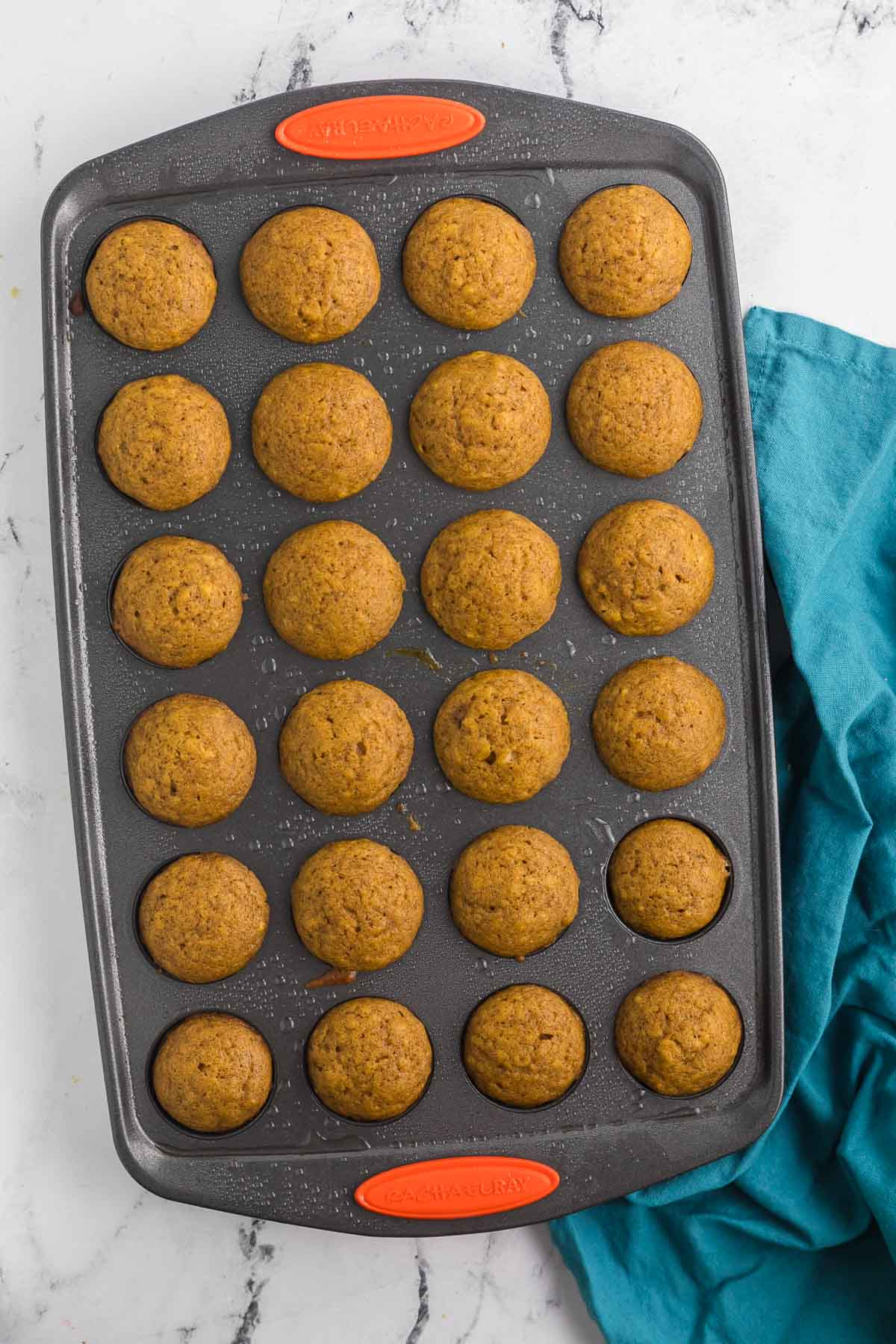 baked mini pumpkin muffins in mini muffin tin