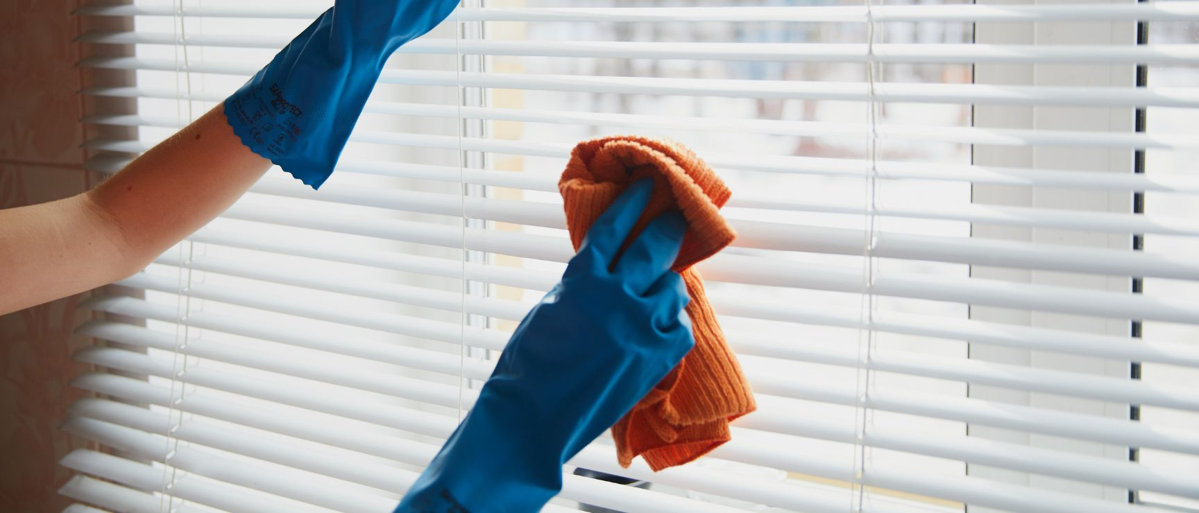 Clean your Venetian window blinds using feather duster, microfiber cloth, or dryer sheets
