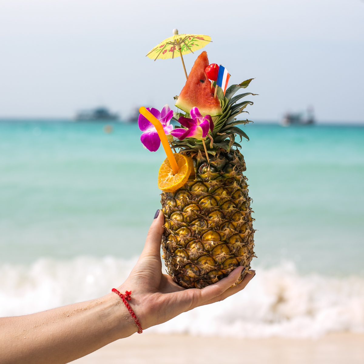 Pine apple in a Hand: Featured In Upside Down Pineapple Symbol & Meaning on a Cruise