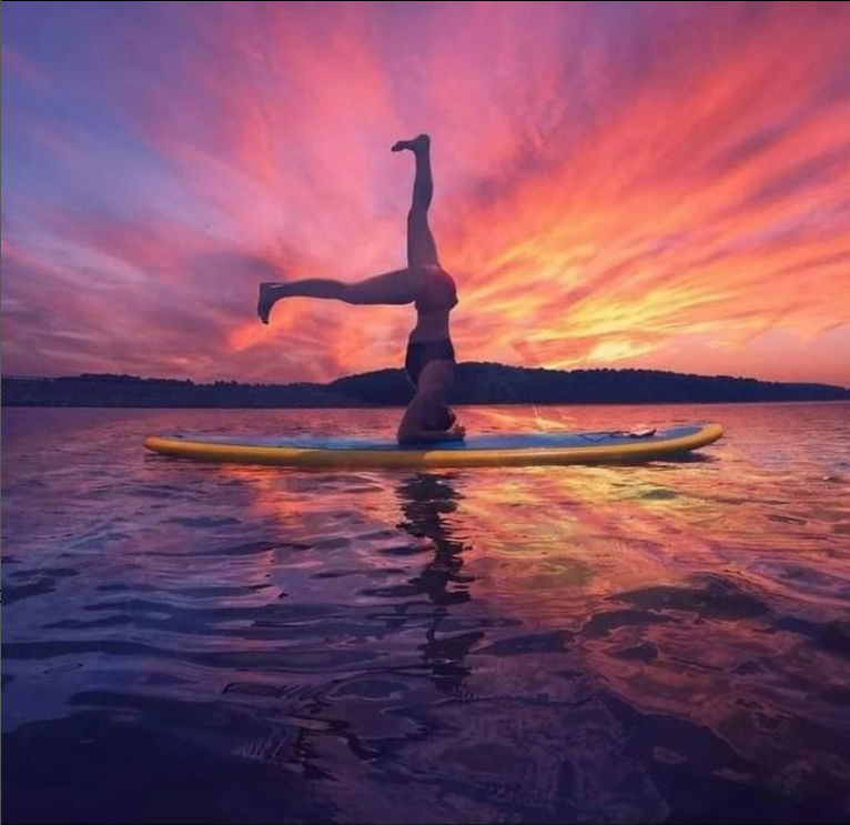 sup yoga on a hard paddle board