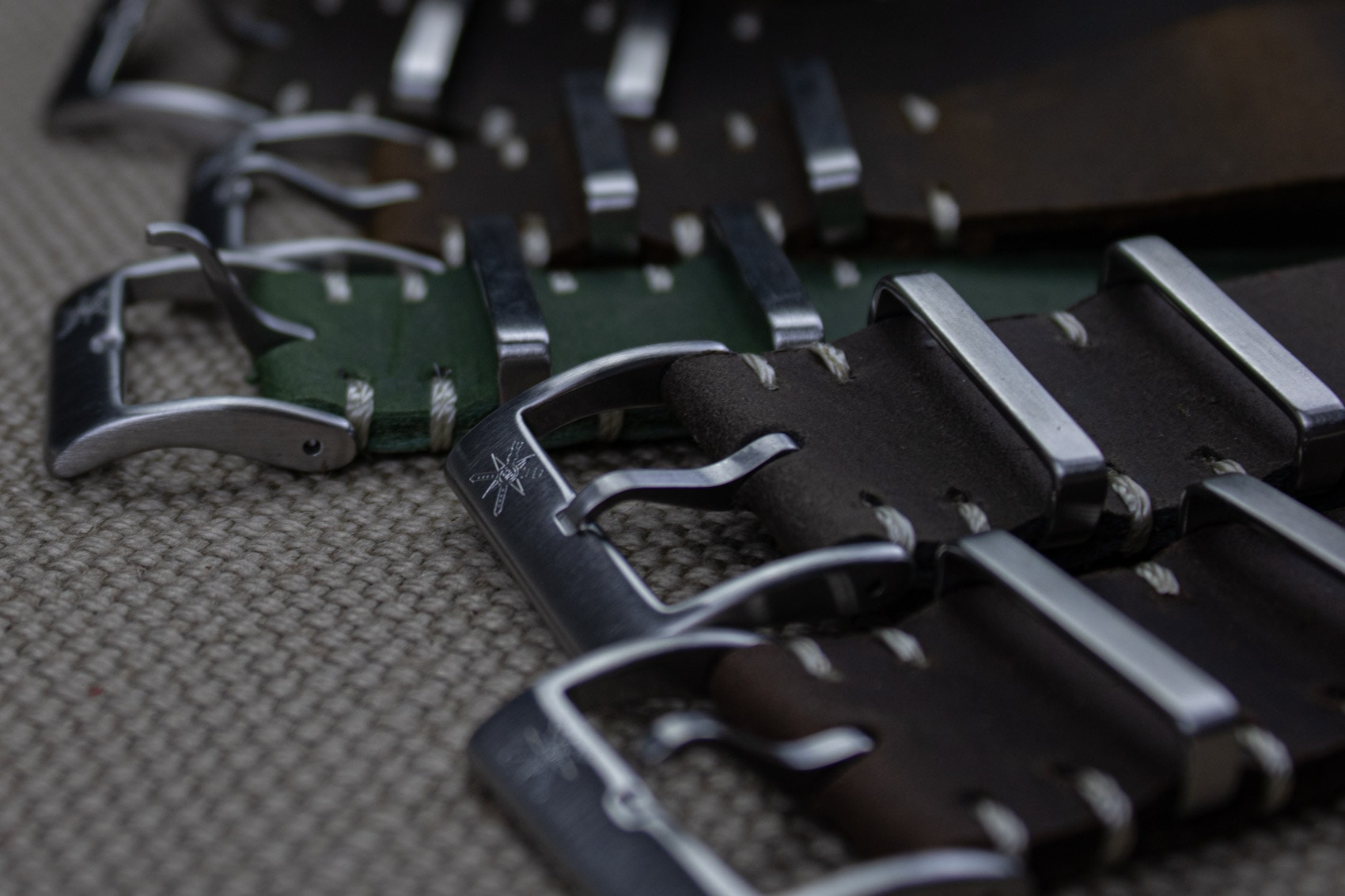 Customizable red leather watch straps showcased.