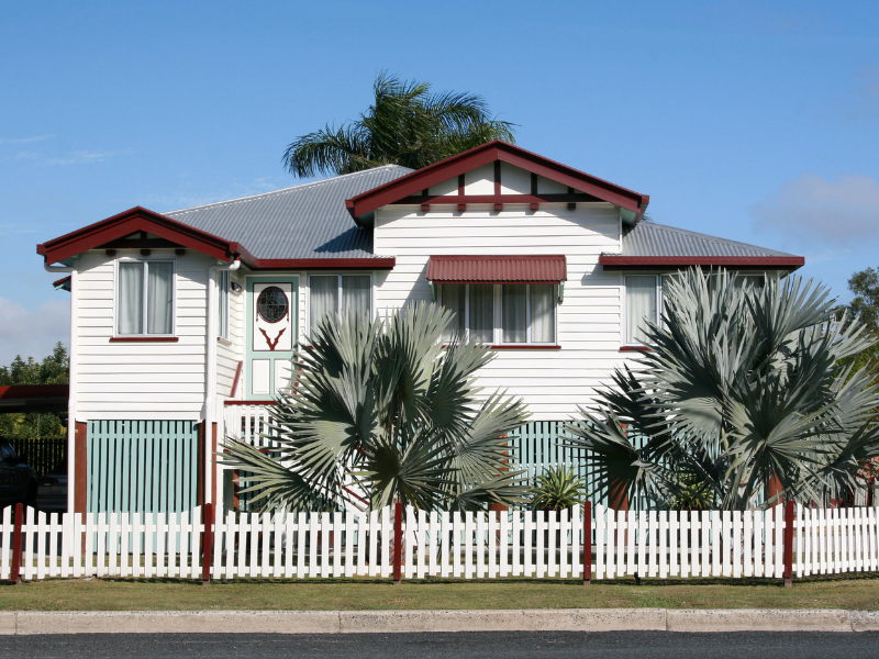 An image showing a well-maintained residential fence enhancing a home's curb appeal.