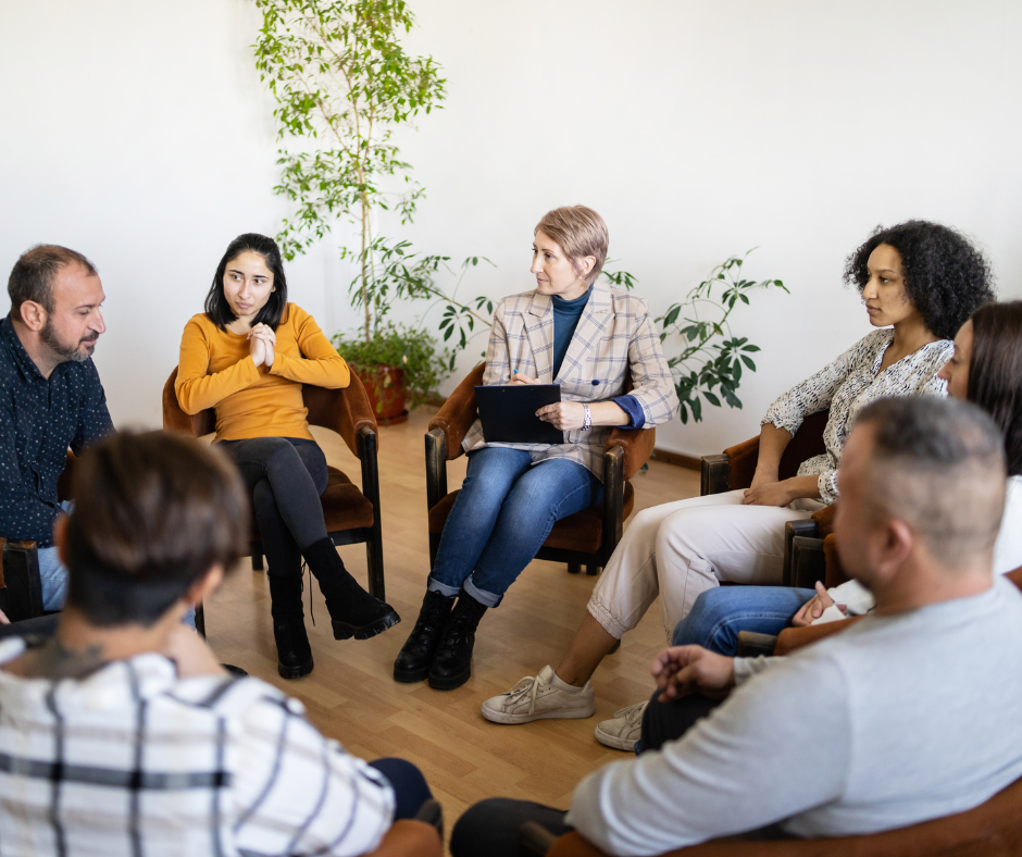 An image of a group of professionals in a supportive environment during their alcohol rehab for professionals program.