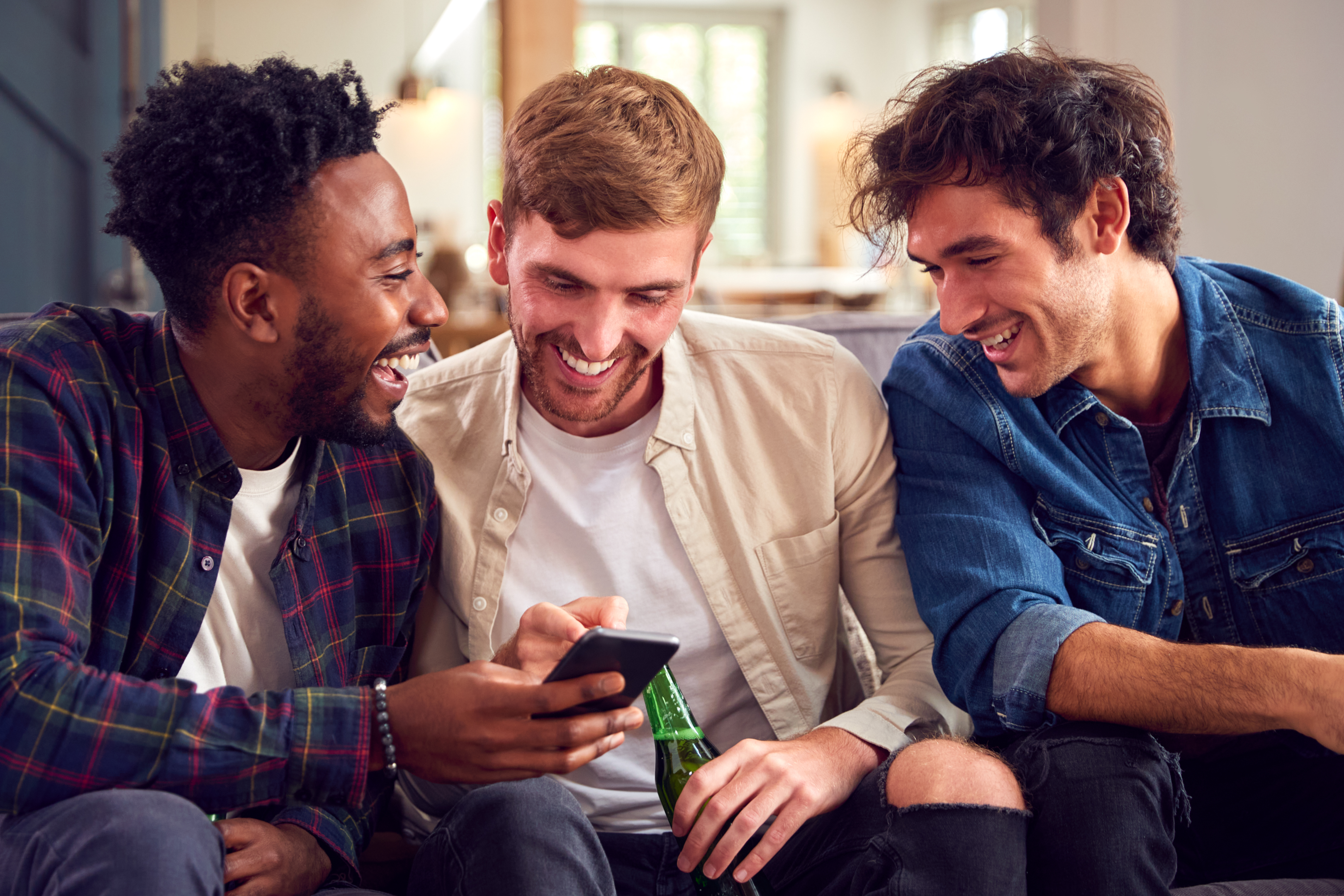 Group of men using mobile