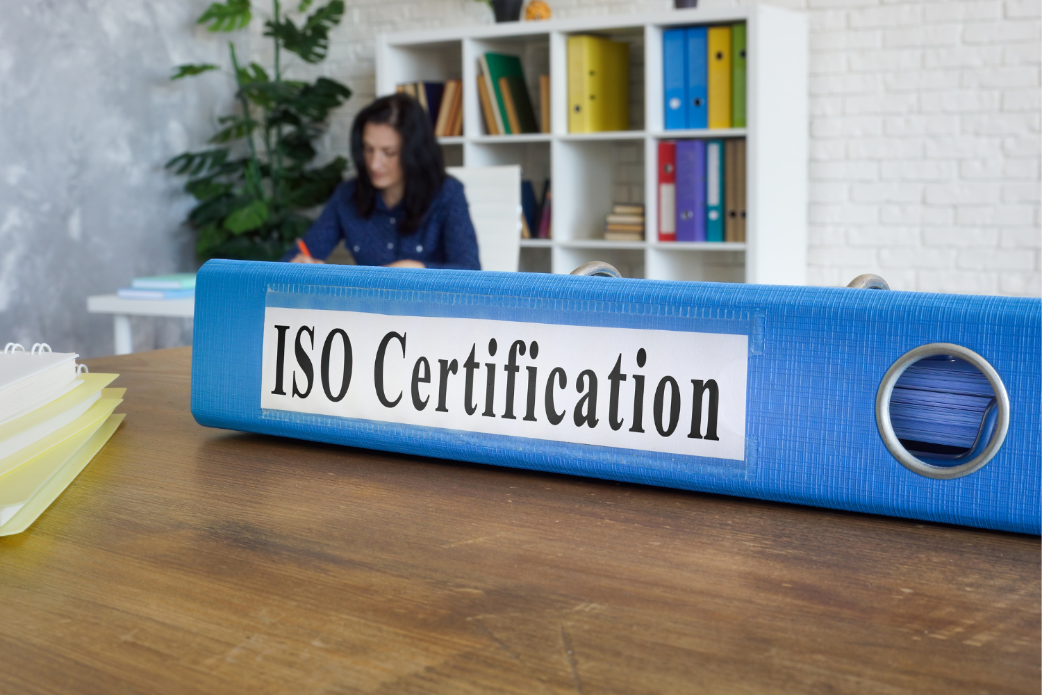 An ISO certification folder.