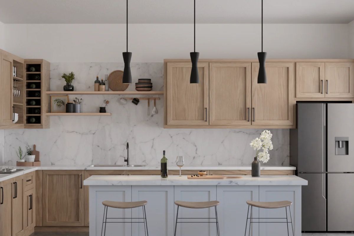 Modern pendant lights with a metal shade hang over a kitchen island, showcasing a sleek light fixture that can trigger contact and purchase through the website.