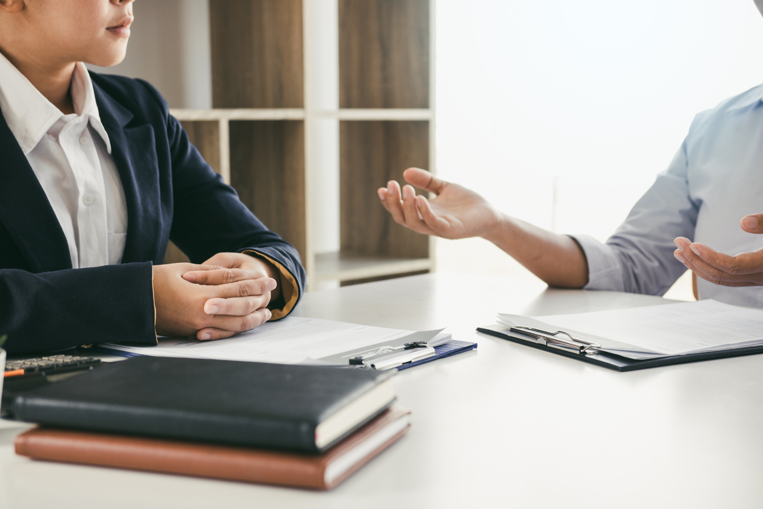 Manager speaking to employee.