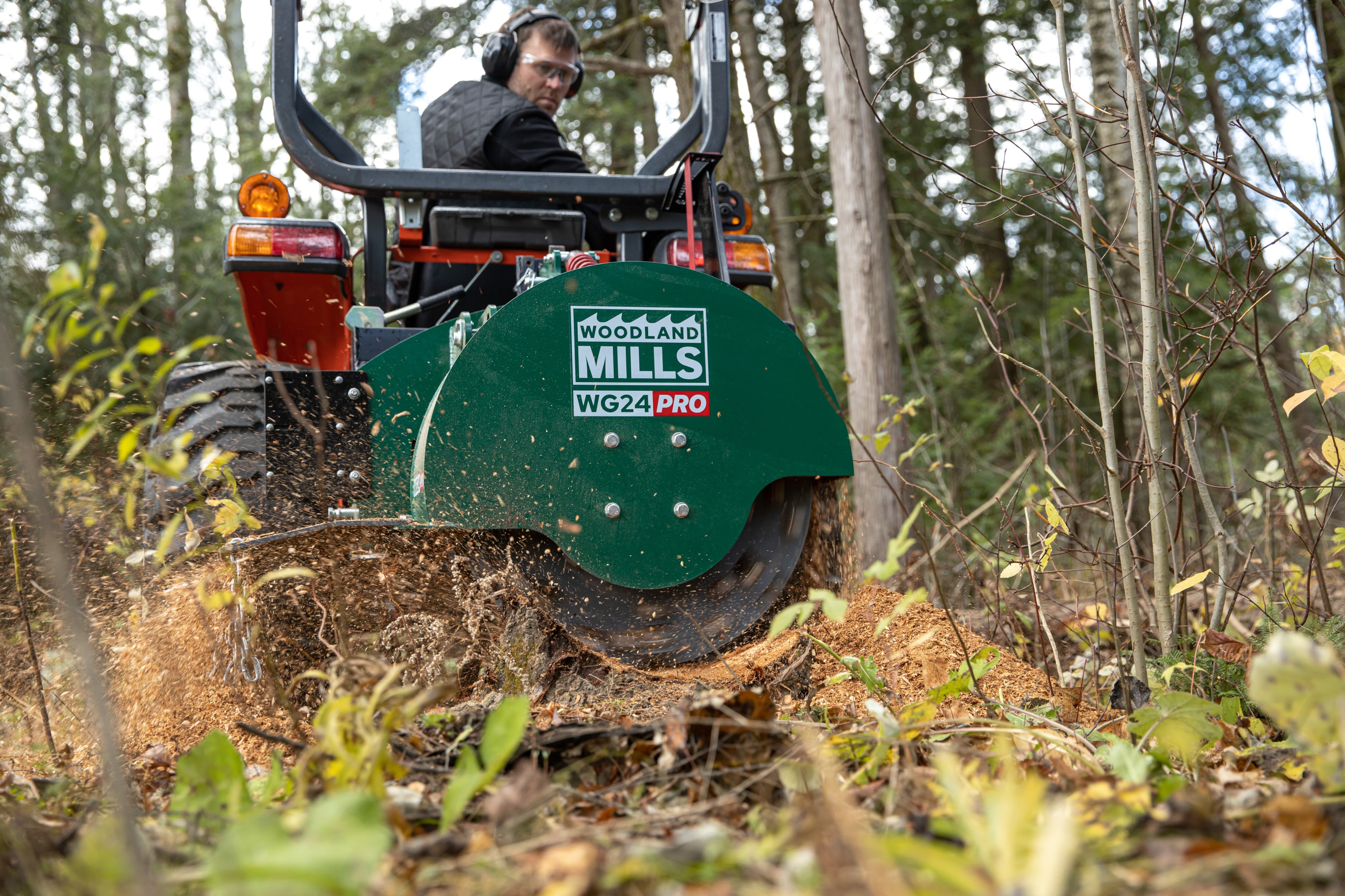 A WG24 PRO stump grinding a tree stump. Many acreage owners save money by buying their own stump grinders over renting them.