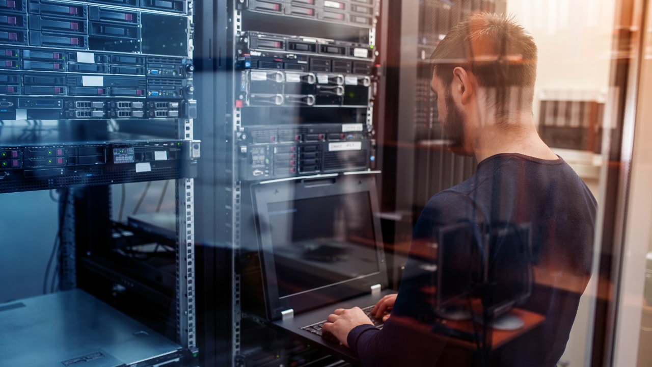IT tech managing network information systems, tech managing data security controls