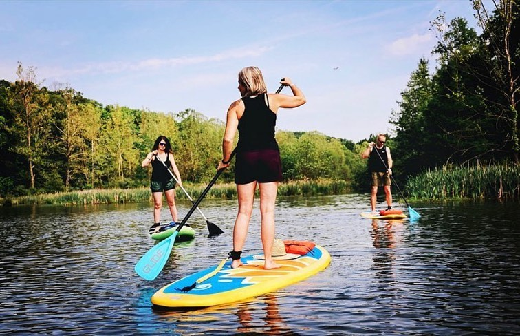 women on paddle boards