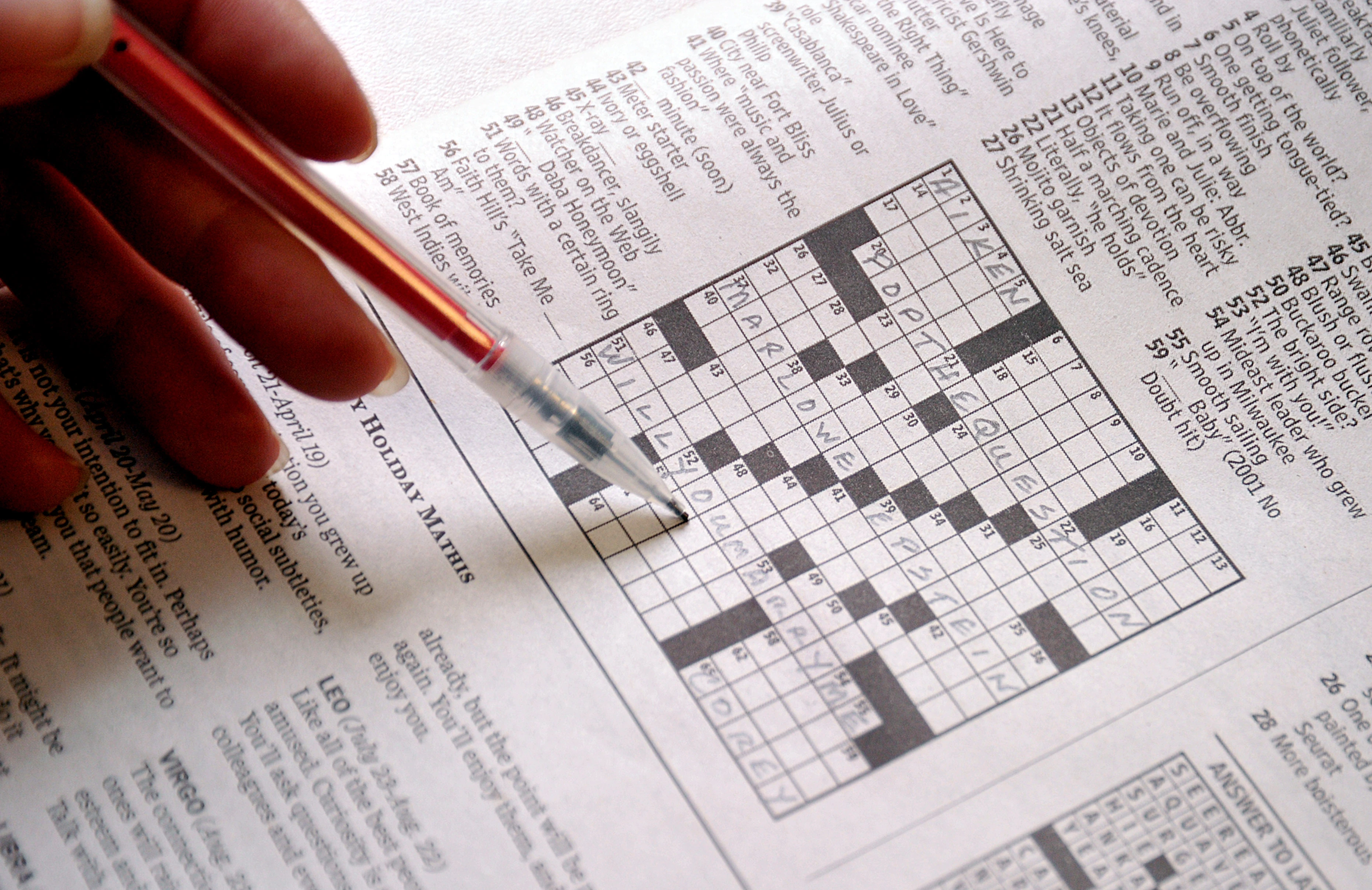 Stay sharp with crossword puzzles. | Photo from AFP via Getty Images