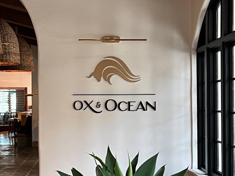 This wall-mounted dimensional letter sign adds a polished touch to the interior of OX & Ocean, reinforcing the restaurant’s high-end aesthetic.