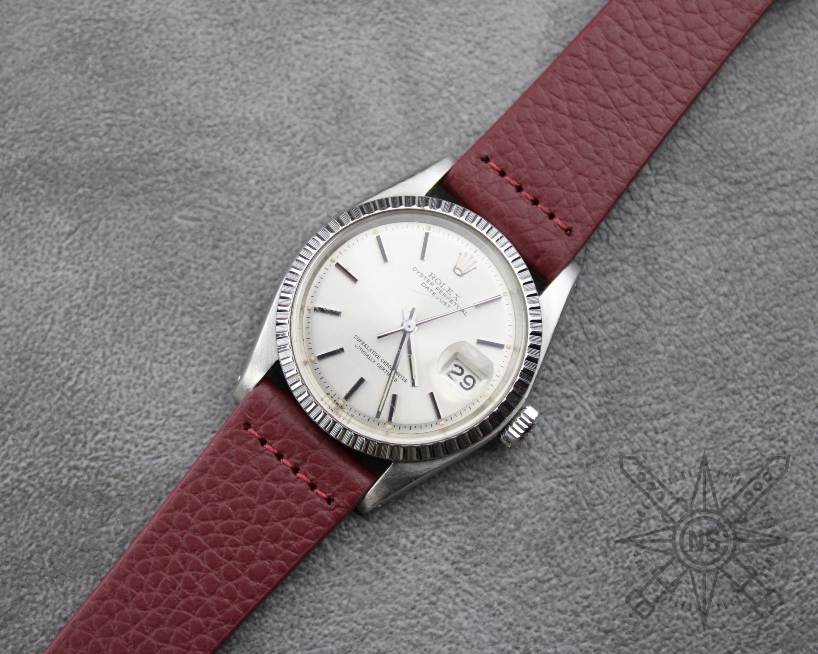 An illustration of attaching a watch strap to a timepiece.