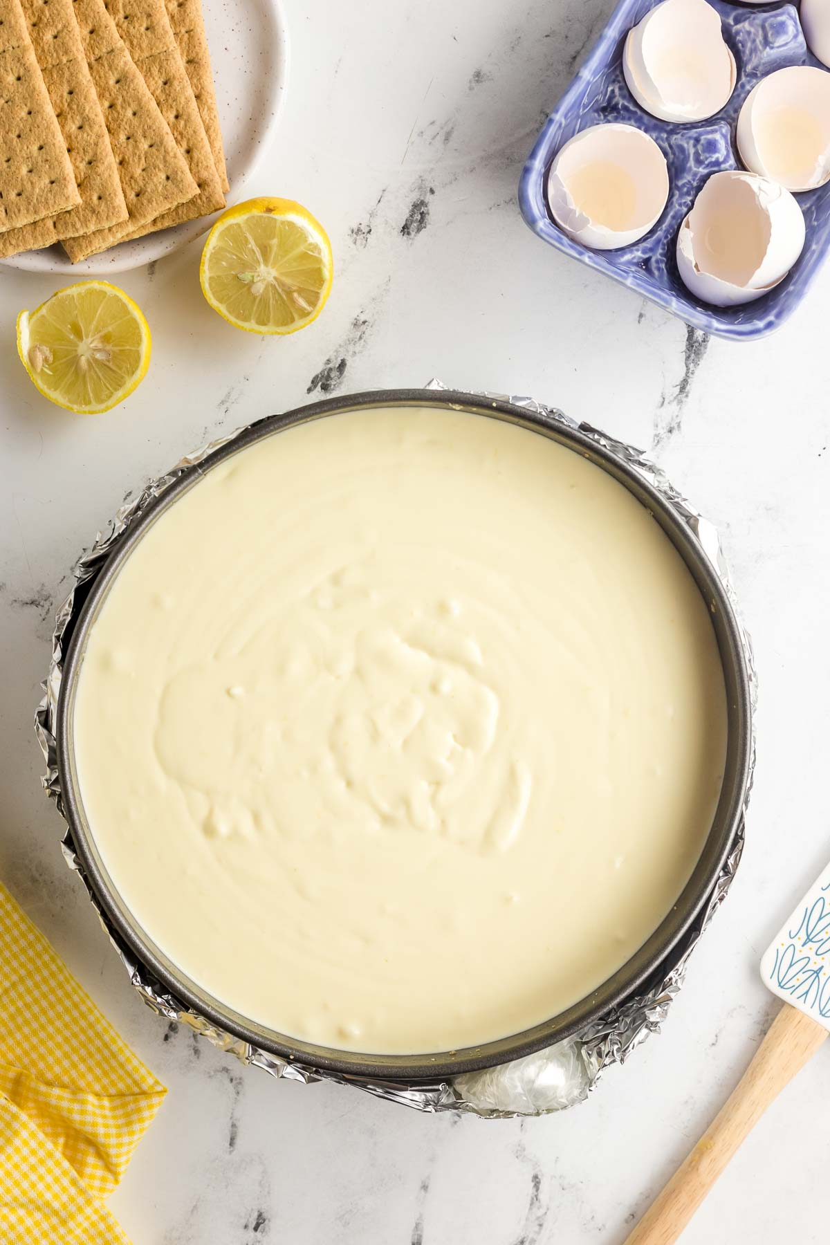 unbaked lemon cheesecake batter in springform pan