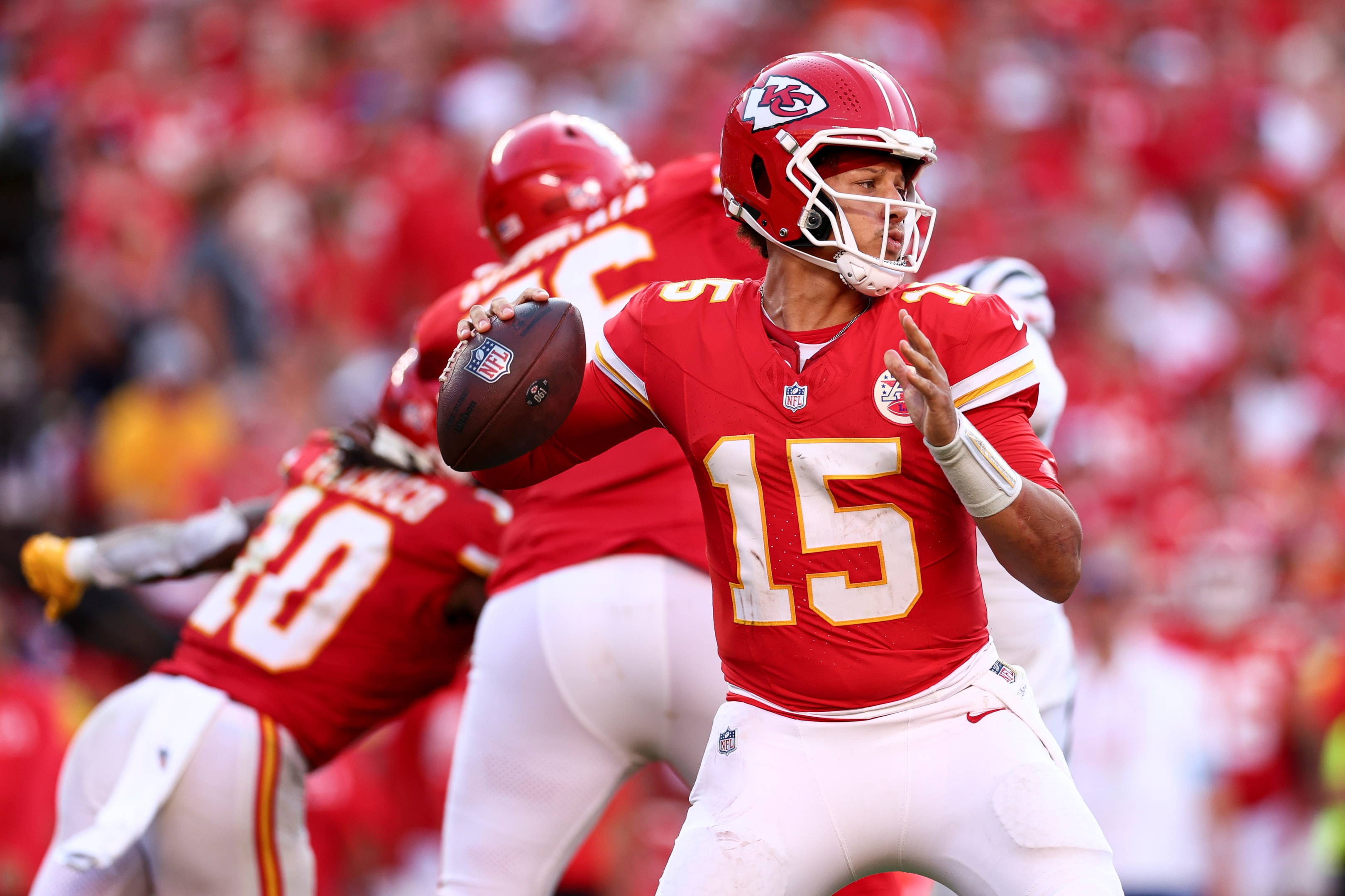 Patrick Mahomes of the Kansas City Chiefs drops back to pass during an NFL football game at Arrowhead Stadium on September 15, 2024 in Kansas City, Missouri.