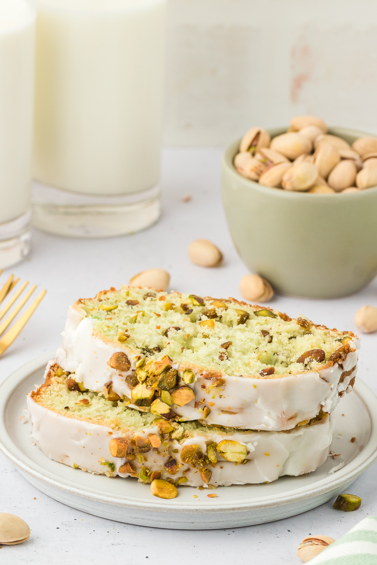 two slices of pistachio quick bread on plate