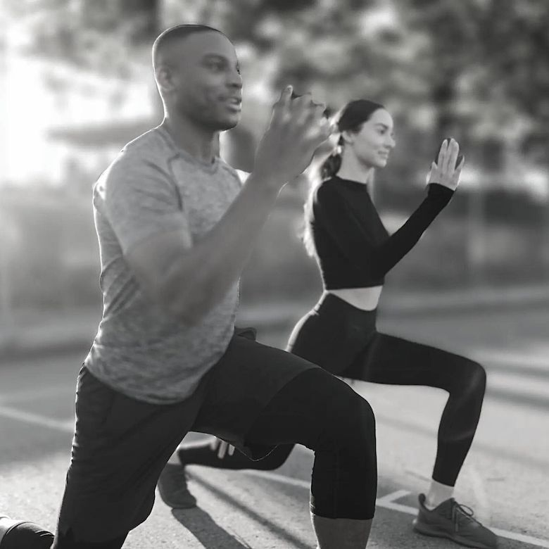 Man and Woman outside working out