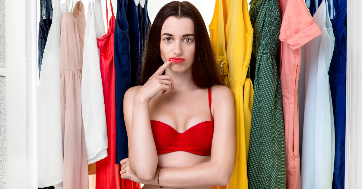 A woman sorting through her wardrobe, wondering, “Are uniforms tax deductible?” 