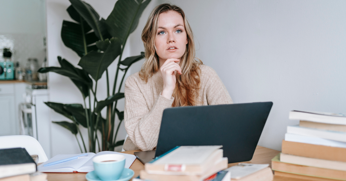 A woman exploring what is the difference between sole proprietor and LLC for her OnlyFans business.