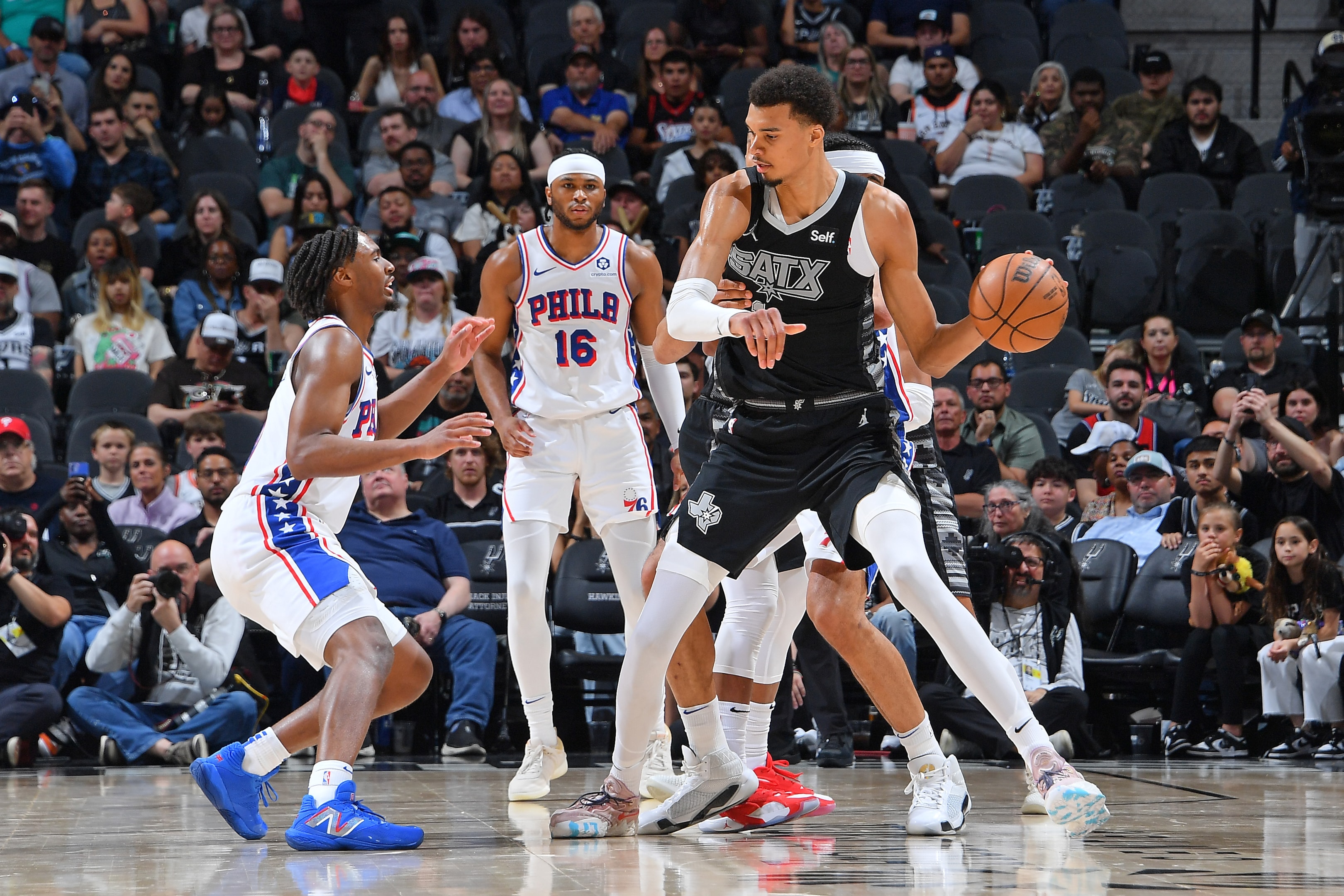 2024 Rookie of the Year Victor Wembanyama of the San Antonio Spurs dribbles the ball during the game against the Philadelphia 76ers.