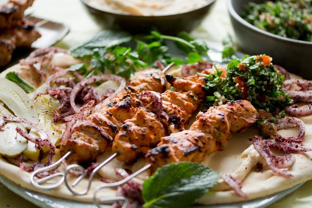 Shish Taouk served on flatbread.