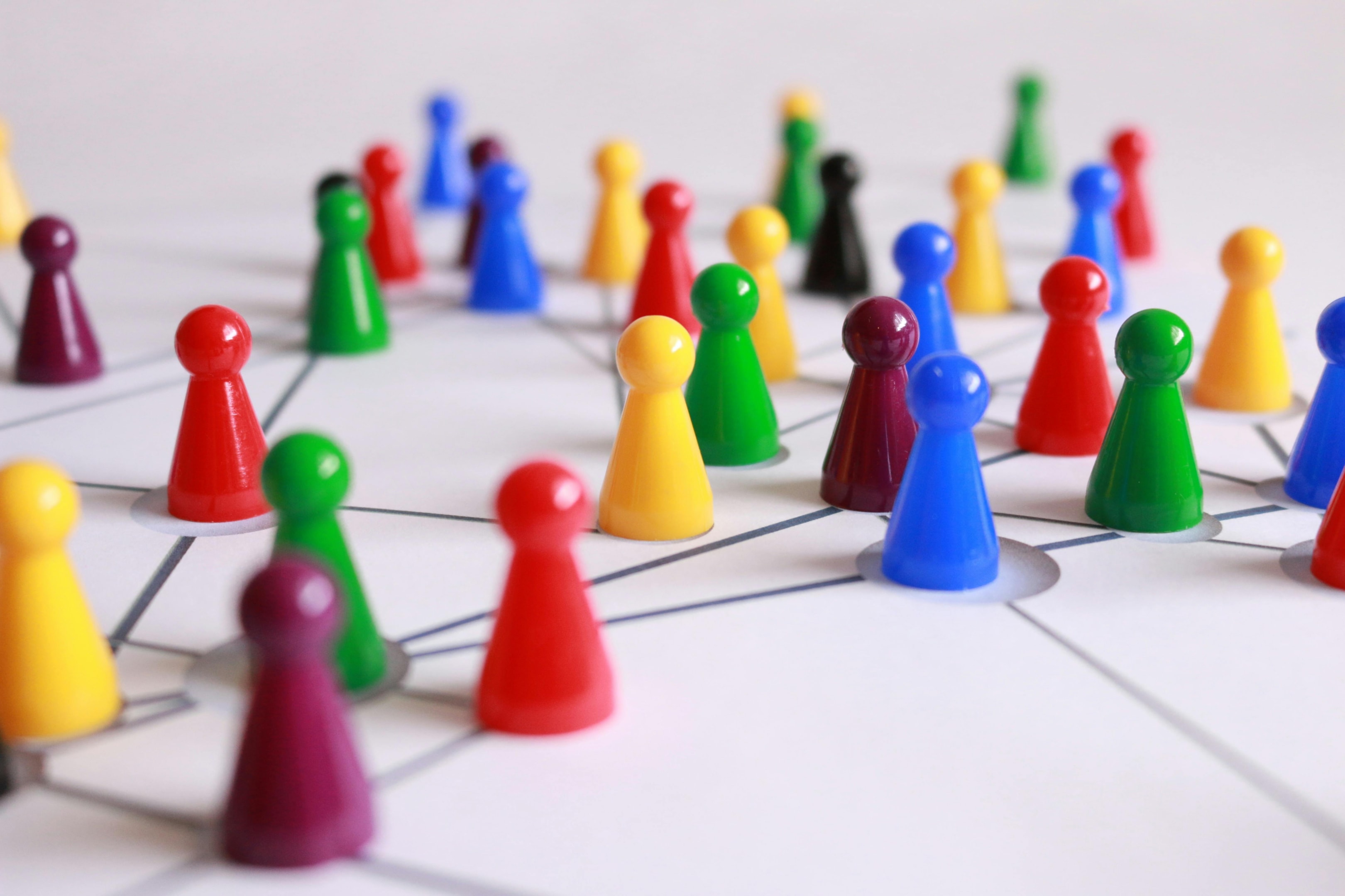 Game pieces connected through lines representing networking.