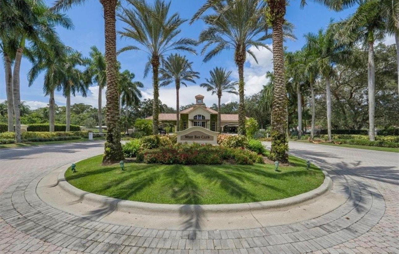 The image showcases the private beach club facilities on Little Hickory Island, featuring waterfront dining options and various recreational amenities such as a resort-style pool and tennis courts. Surrounded by the natural beauty of Southwest Florida, this exclusive community offers residents access to the Gulf of Mexico and stunning views of Estero Bay.