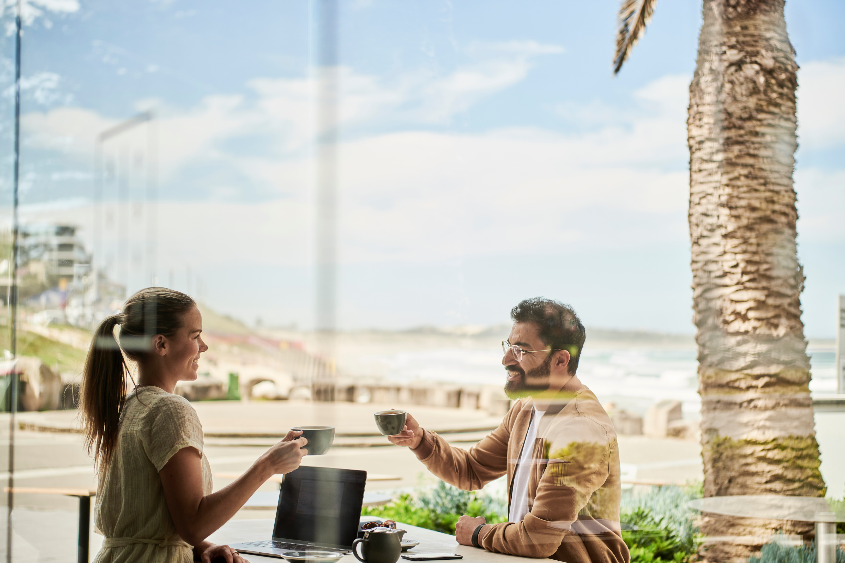 Some Agents Don't Get Enough Leads, Here's How To Stand Out Photo of a man and woman sitting outside a coffee shop.