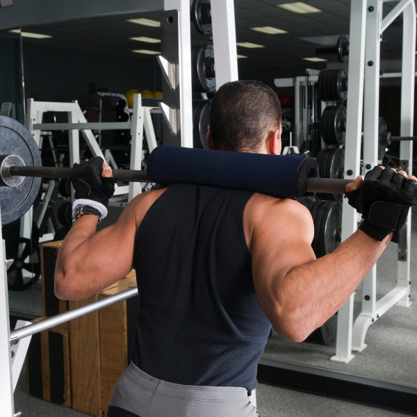 Image showing different squat variations performed in a power rack.