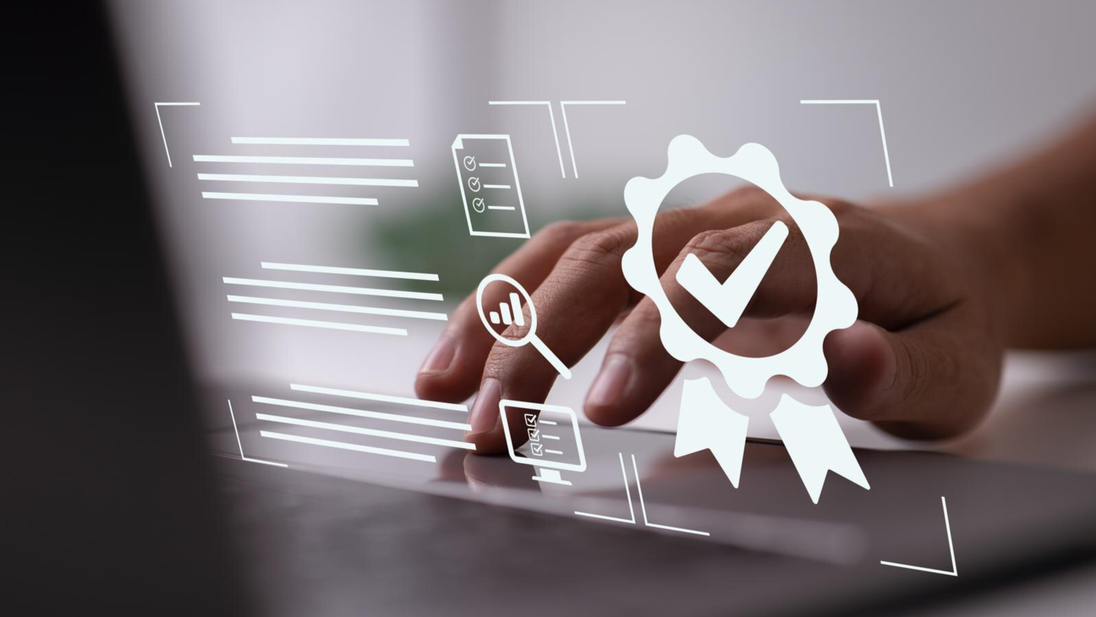 Close-up of hand typing on laptop with digital certification icons, symbolizing hurdles in the Microsoft Operator Connect Program.