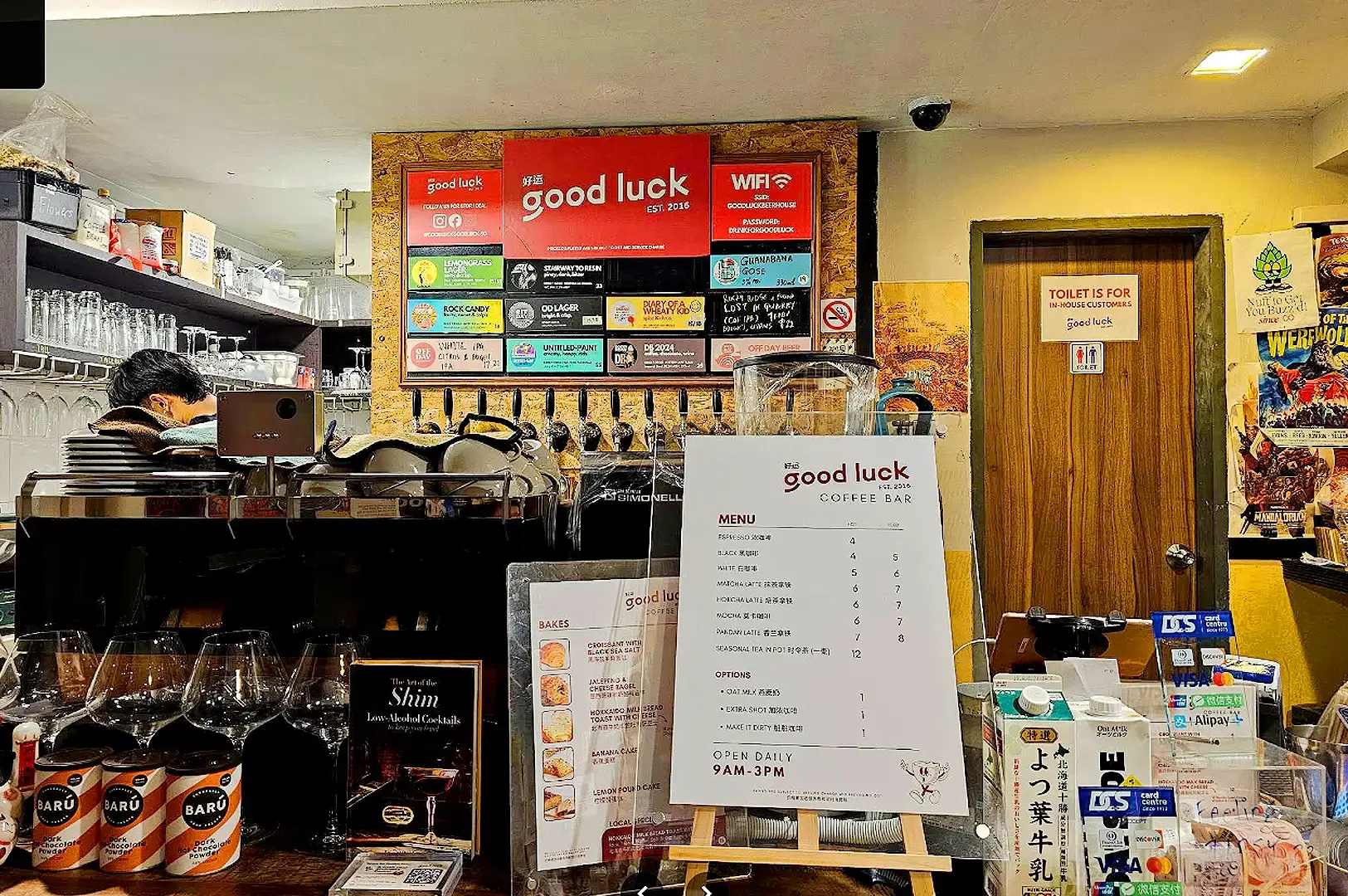 Good Luck Coffee Bar Singapore interior with craft beer taps and menu