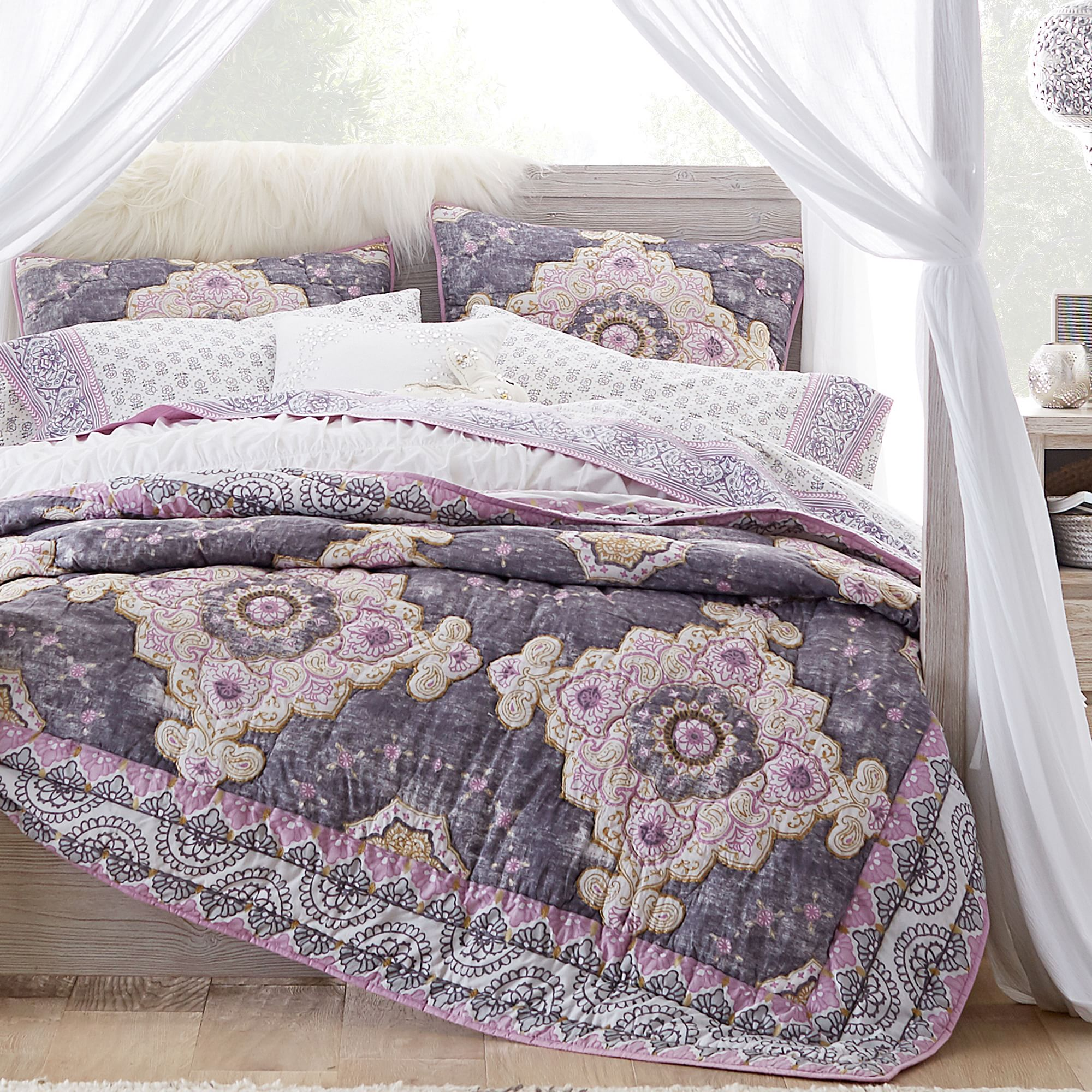 purple geometric patterned bedding with canopy