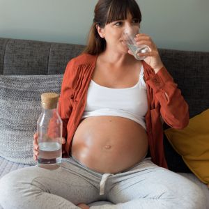 pregnant woman drinking water
