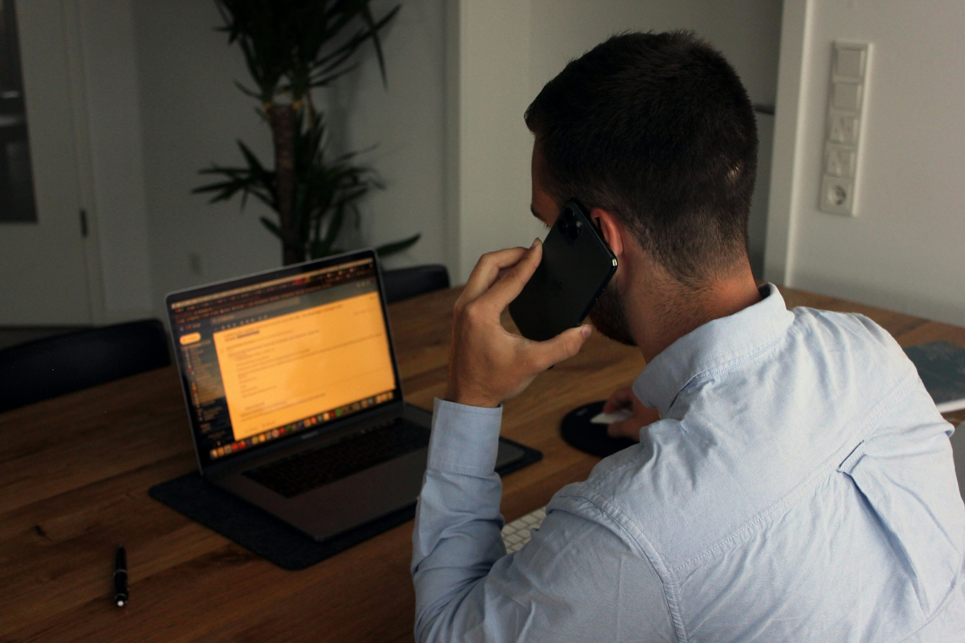 Real estate investor coordinates deals for his remote business over the phone.