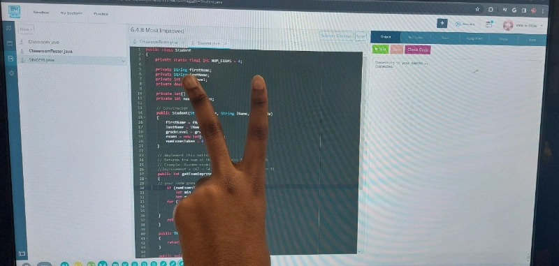 a coding student celebrates completing a project