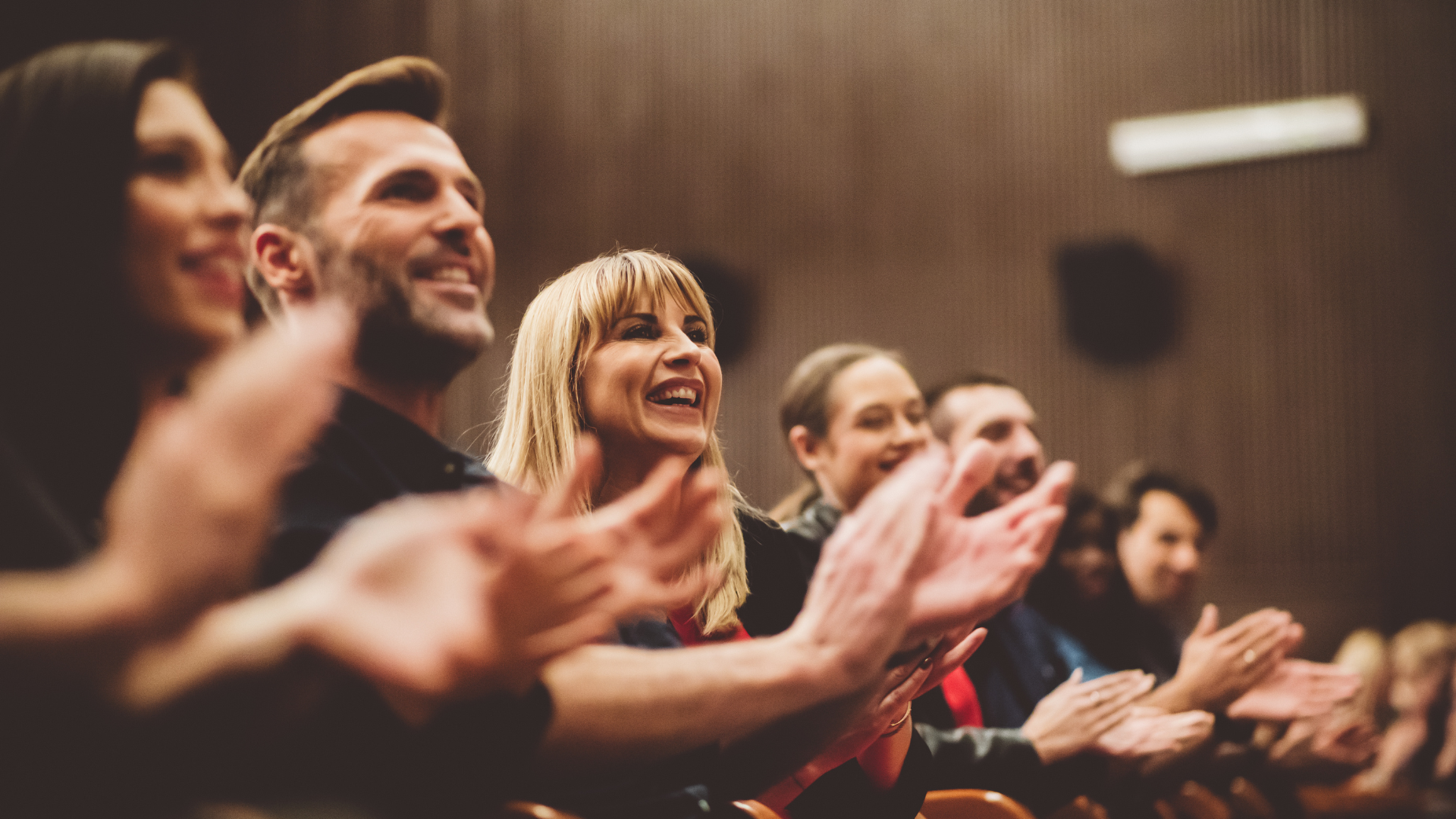 audience members clapping