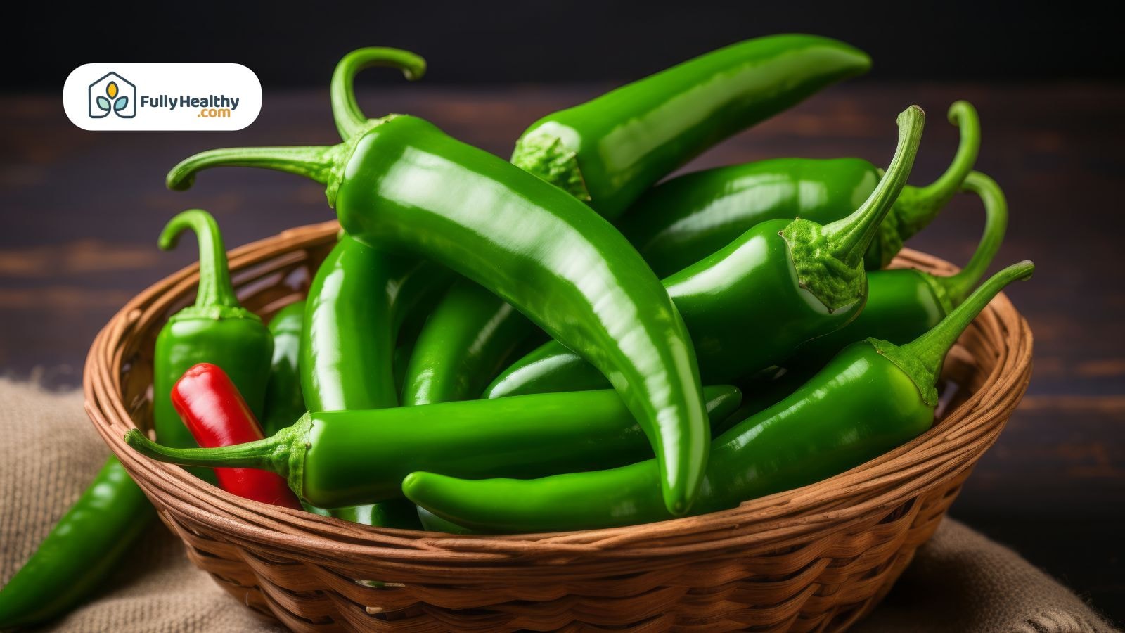 Basket of green jalapeño peppers with one red pepper visible