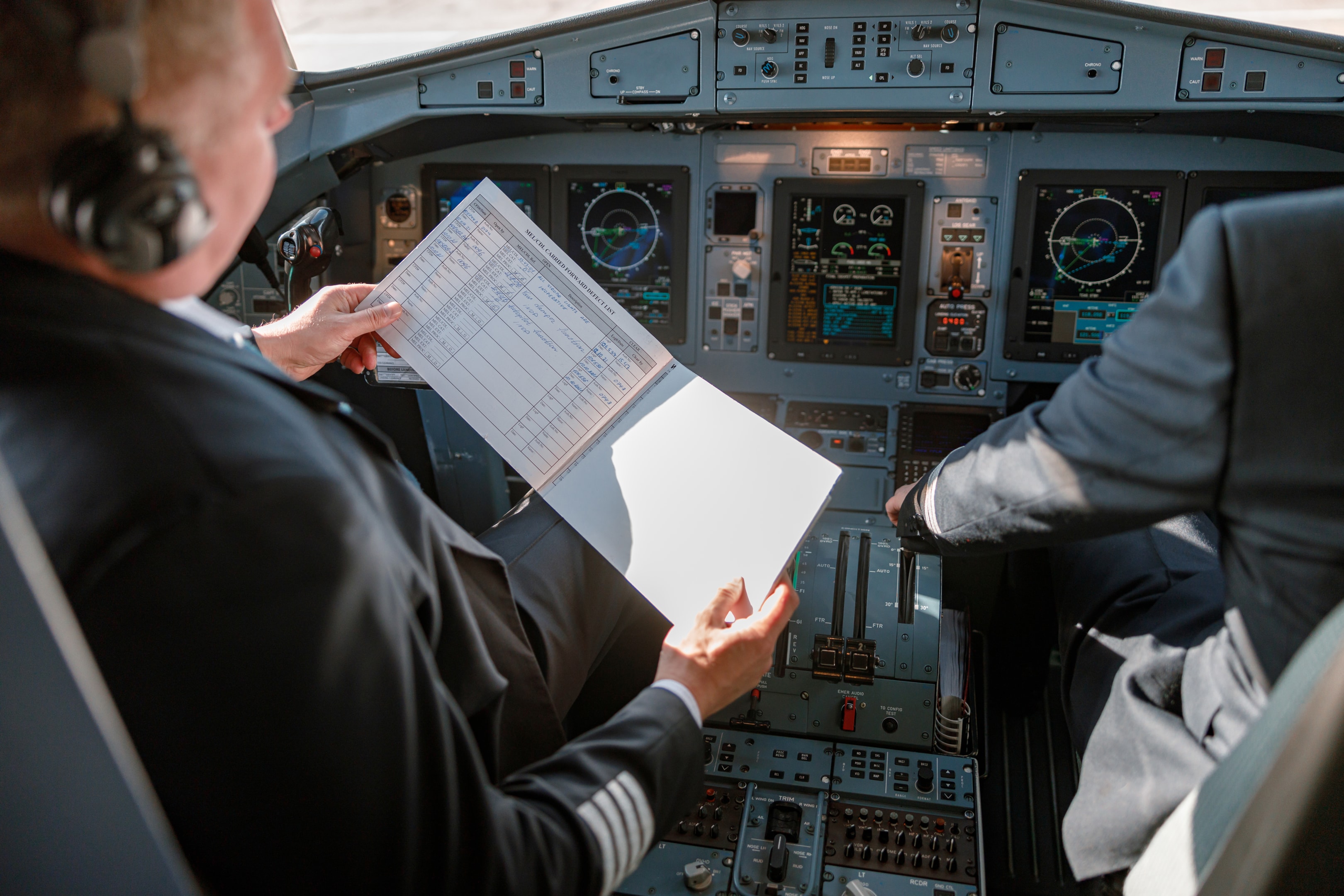 aircraft pilot reading documents