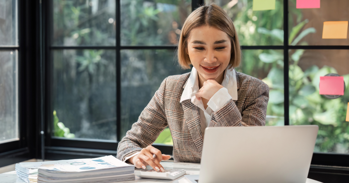 A woman reviewing bookkeeper accounting software 