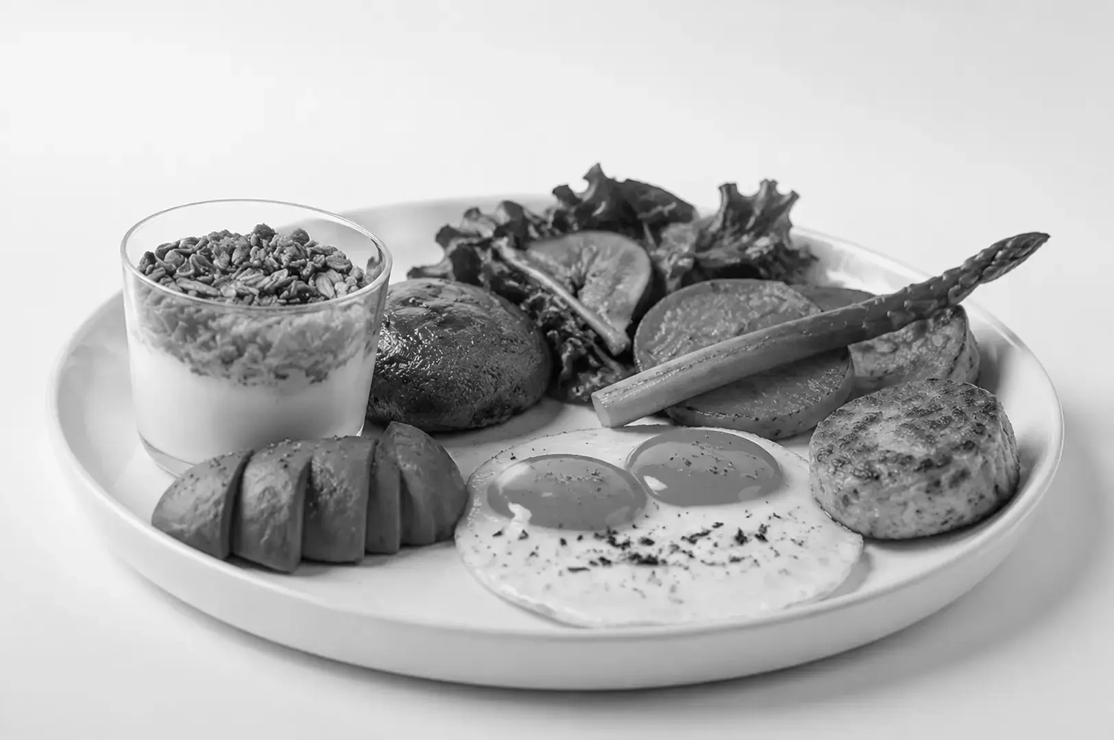 A variety of vegetarian dishes with eggs, dairy-based ingredients, vegetables, and noodles.