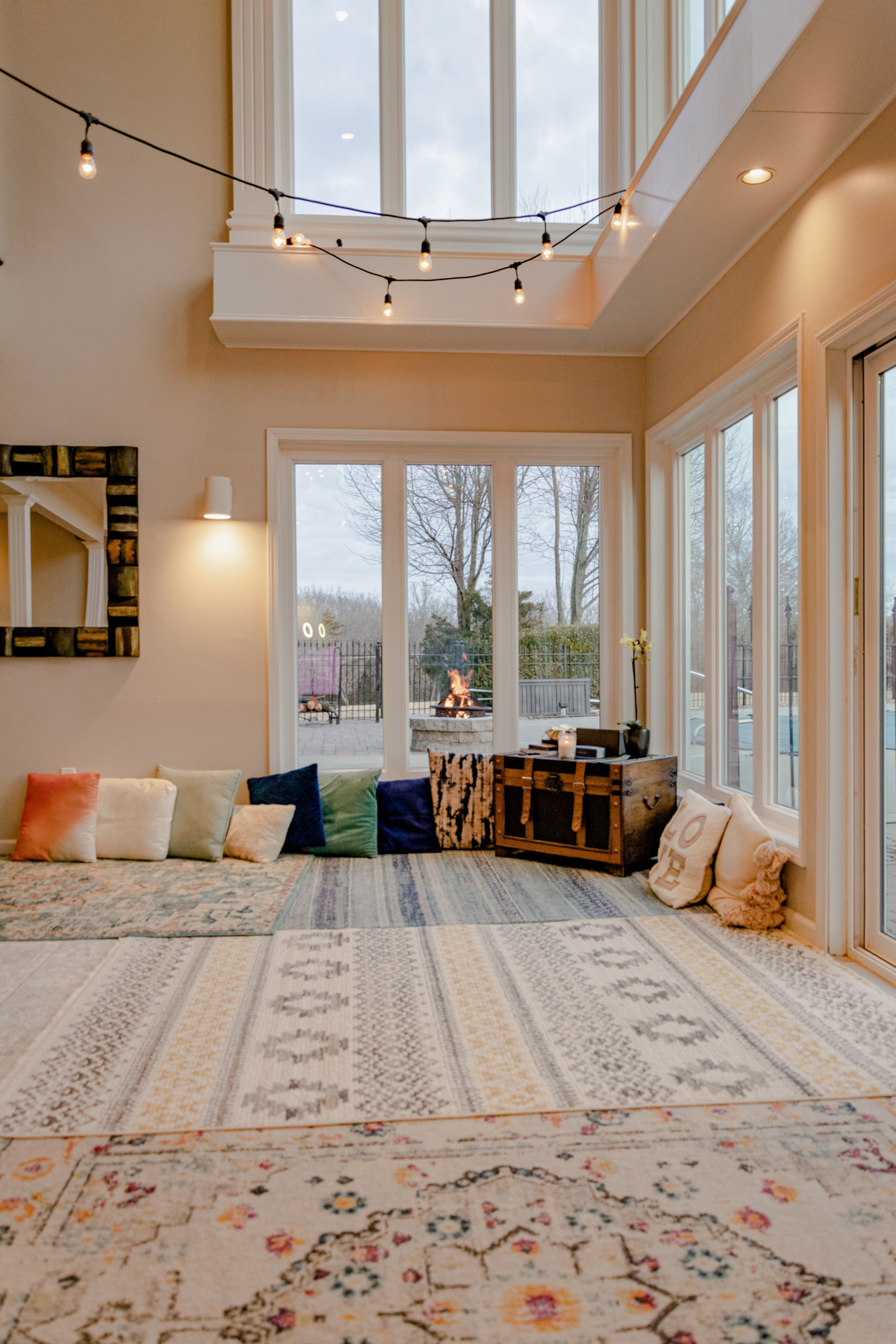 meditation retreat space with pillows carpets and big windows 