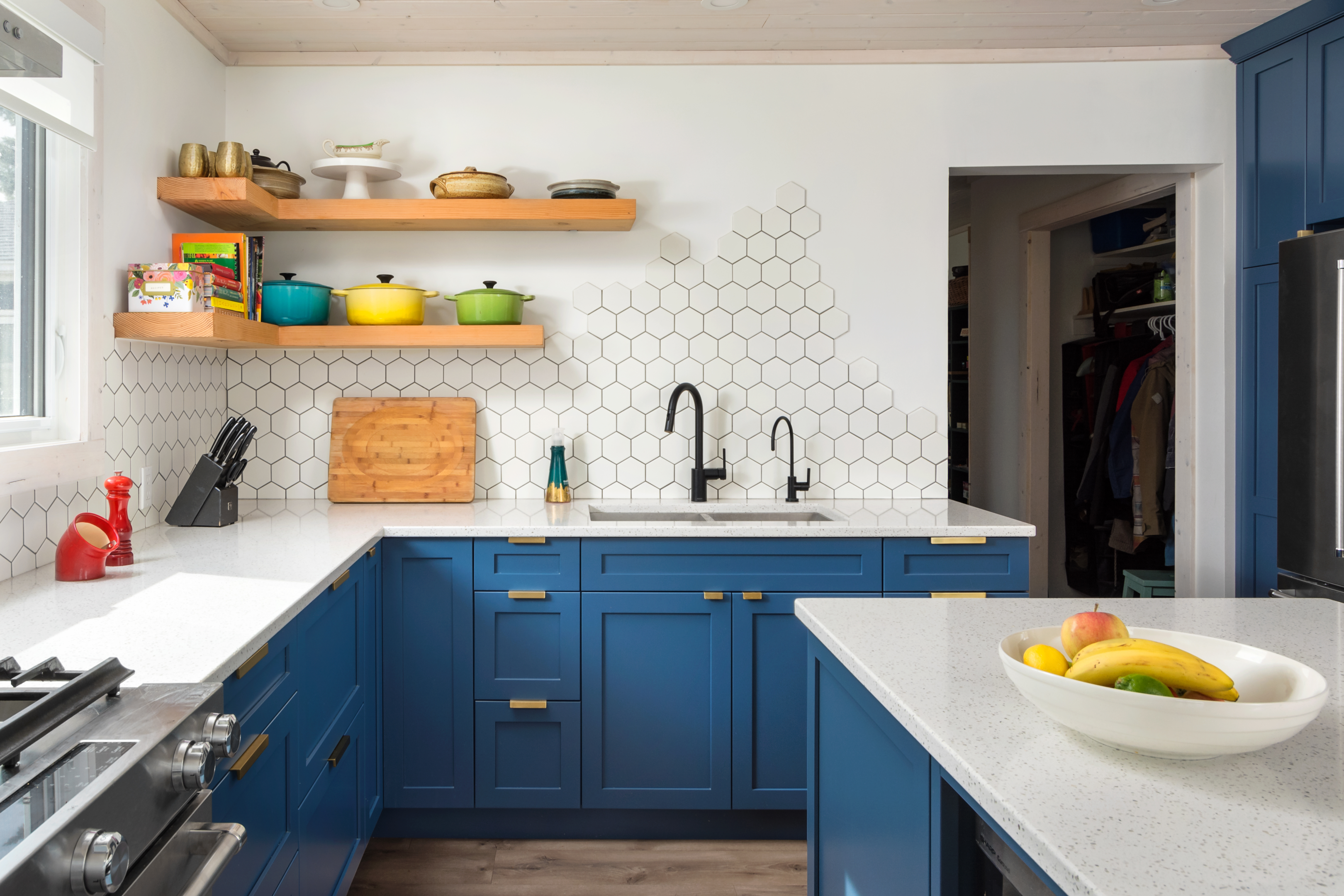 blue modern kitchen with floating shelves 2024 trends