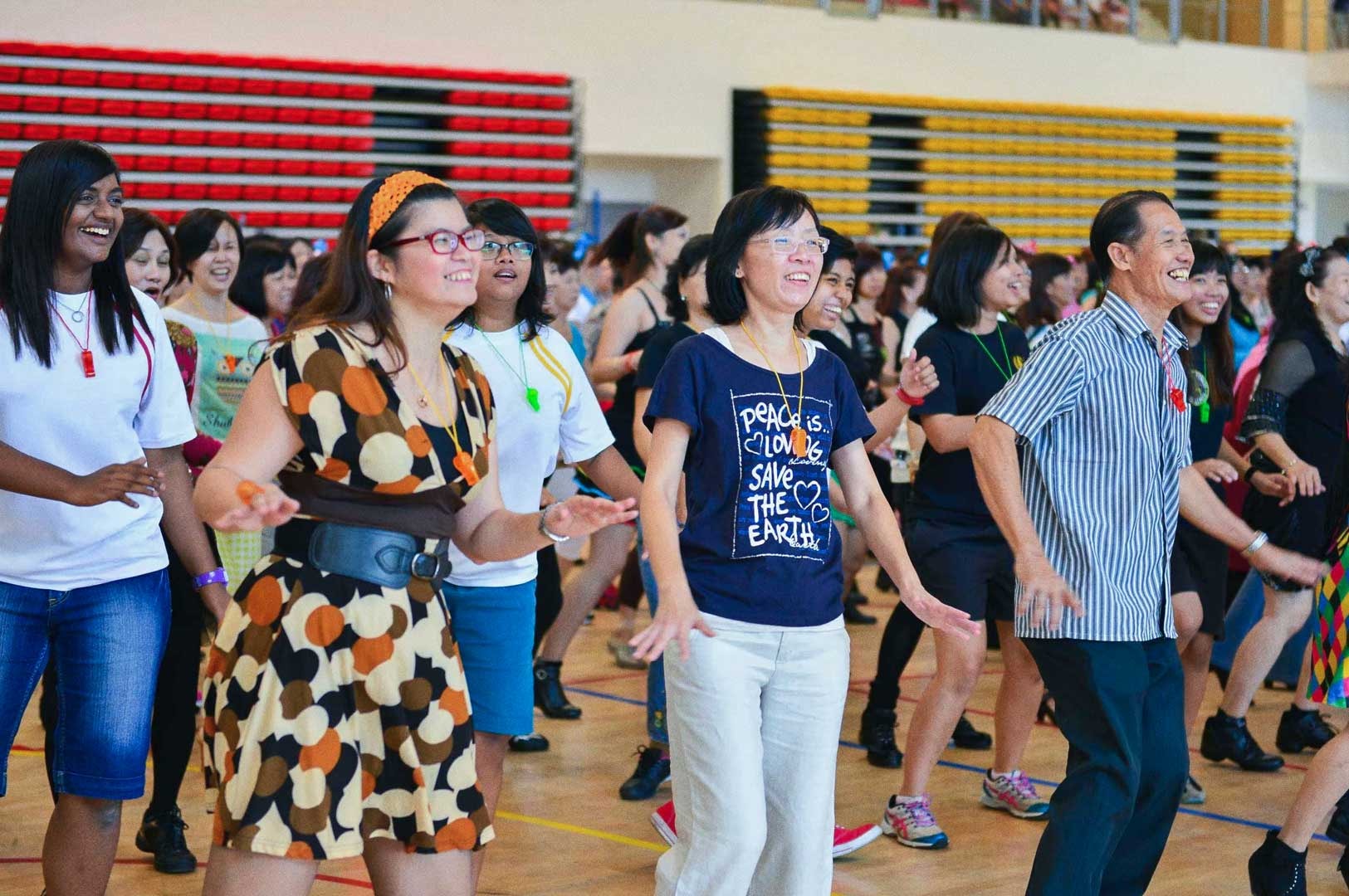 Participants dancing together in a community line dance activity.
